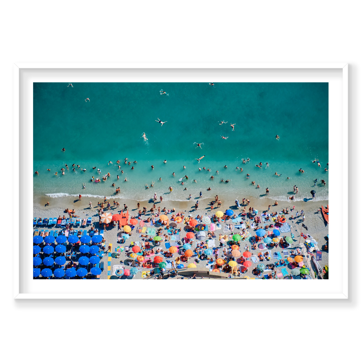 Swimmers in turquoise water beside colourful beach umbrellas at Monterosso al Mare, Cinque Terre, Italy, white frame.