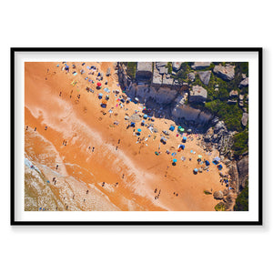 Aerial view of North Curl Curl Beach with golden sand, colorful umbrellas and swimmers, photography print by Remy Gerega