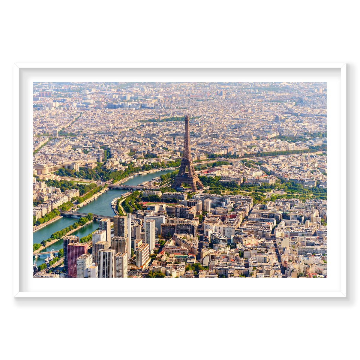 Wide aerial view of the Eiffel Tower, the Seine, bridges and surrounding Paris rooftops in daylight; white frame