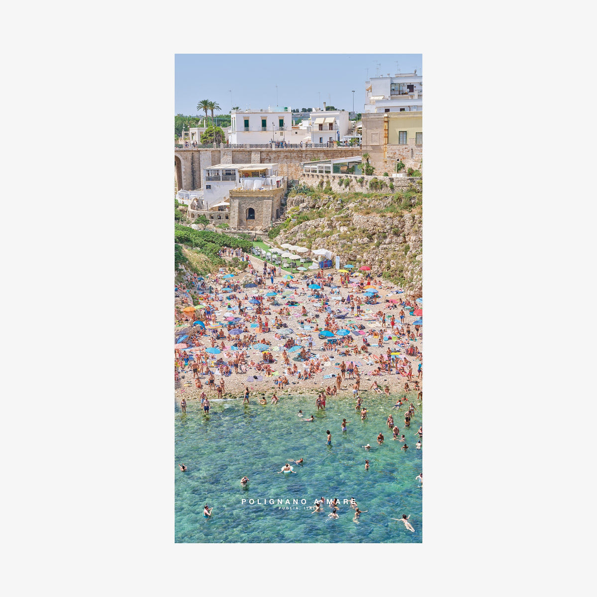 Polignano a Mare Italian beach aerial view with turquoise water and crowded sandy cove, quick-dry beach towel by Remy Gerega