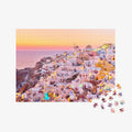 Santorini village at sunset with white-washed buildings and golden lights, 500 piece jigsaw puzzle by Remy Gerega