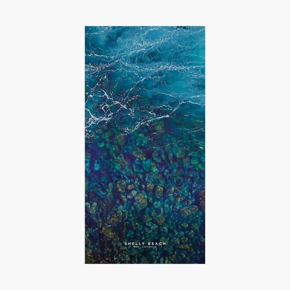 Aerial view of Shelly Beach NSW showing turquoise water and rocky reef formations from above, quick-dry beach towel by Remy Gerega