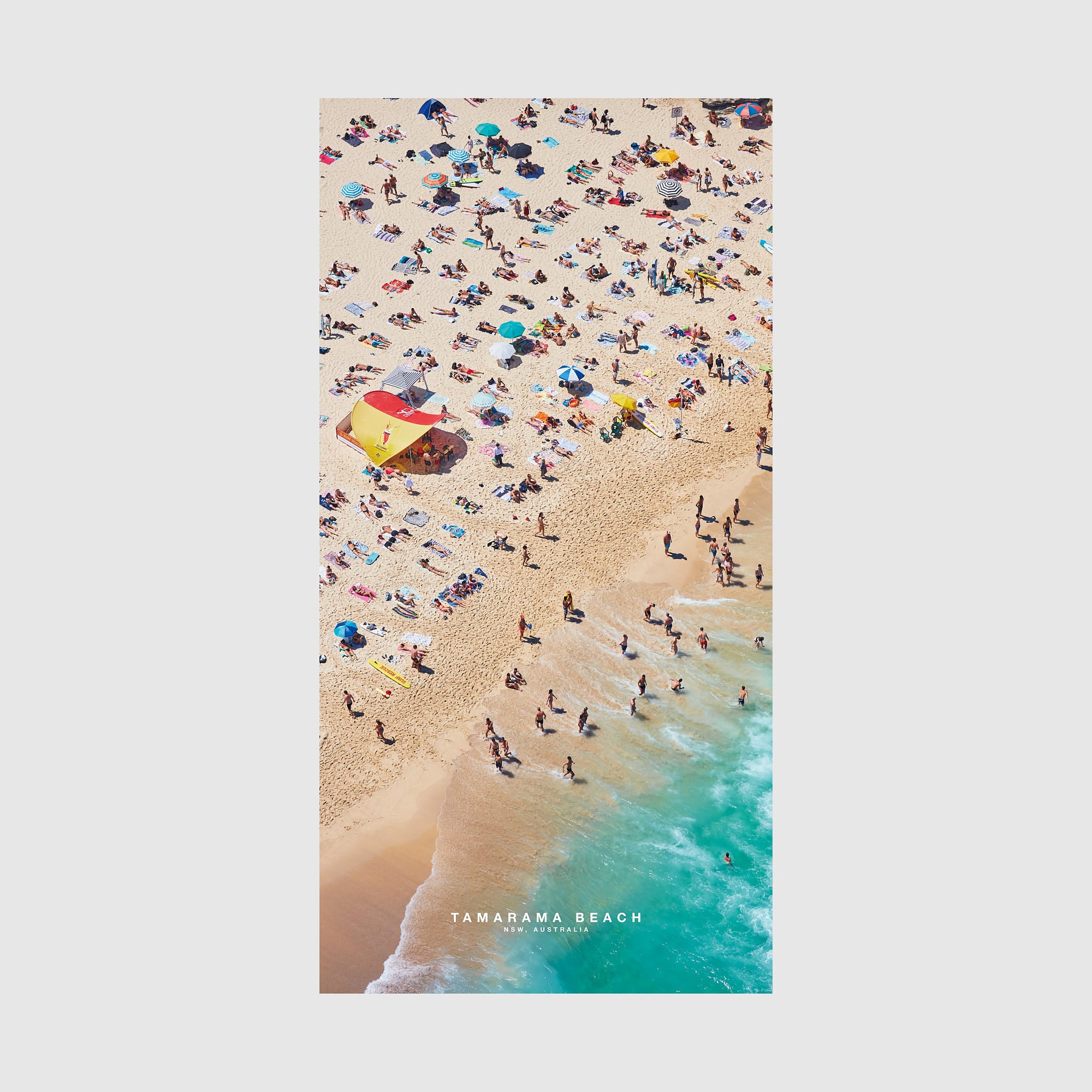 Aerial view of Tamarama Beach NSW with colorful umbrellas and swimmers, quick-dry beach towel by Remy Gerega
