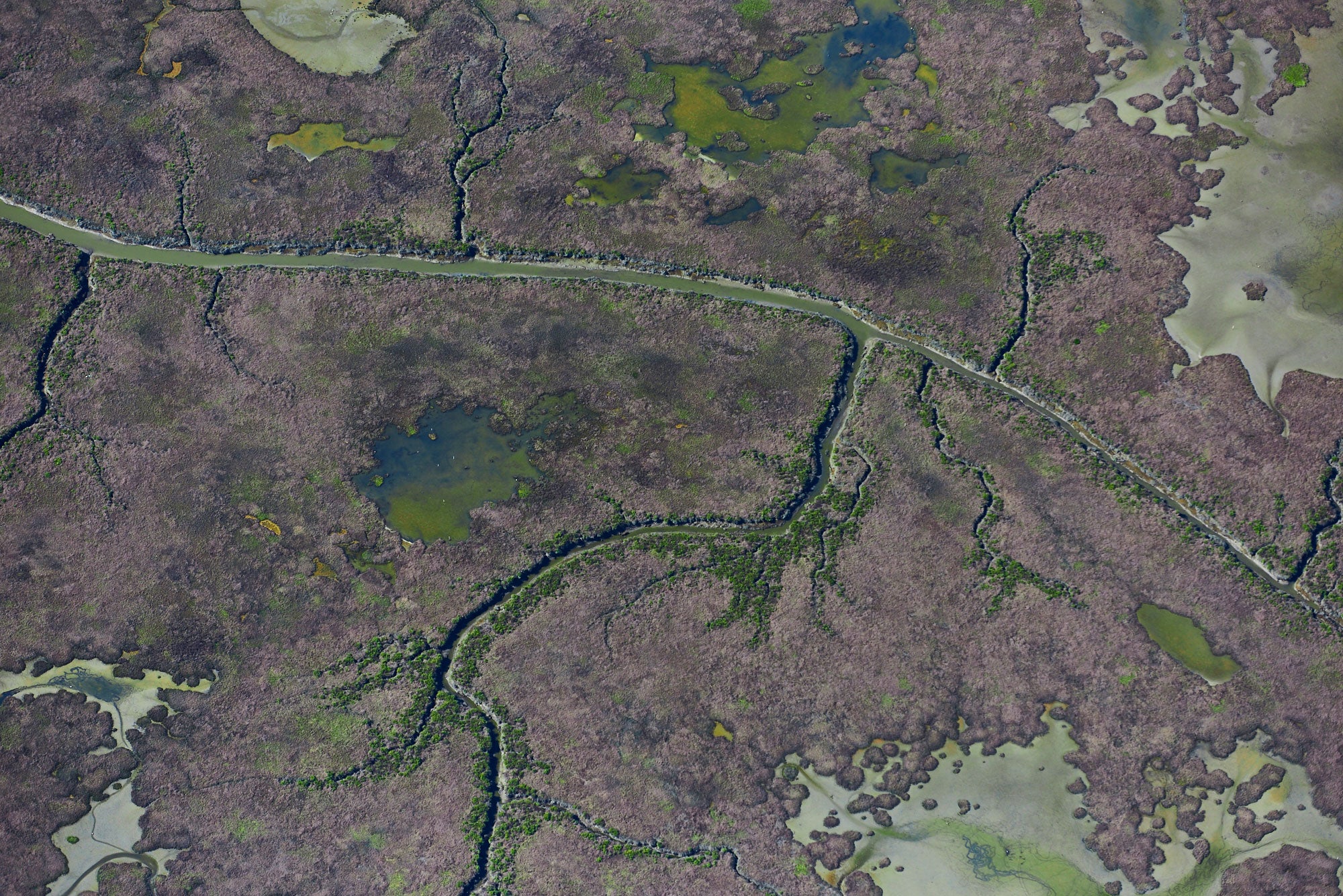 Aerial photography from a doorless R22 helicopter over the San Francisco Bay Cargill Salt Ponds. Limited & open edition fine art prints available for purchase. 