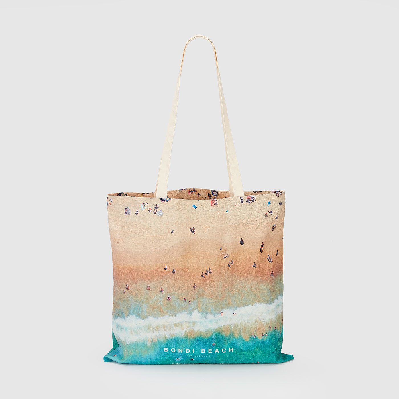 Aerial view of Bondi Beach with swimmers and waves, canvas tote bag by Remy Gerega