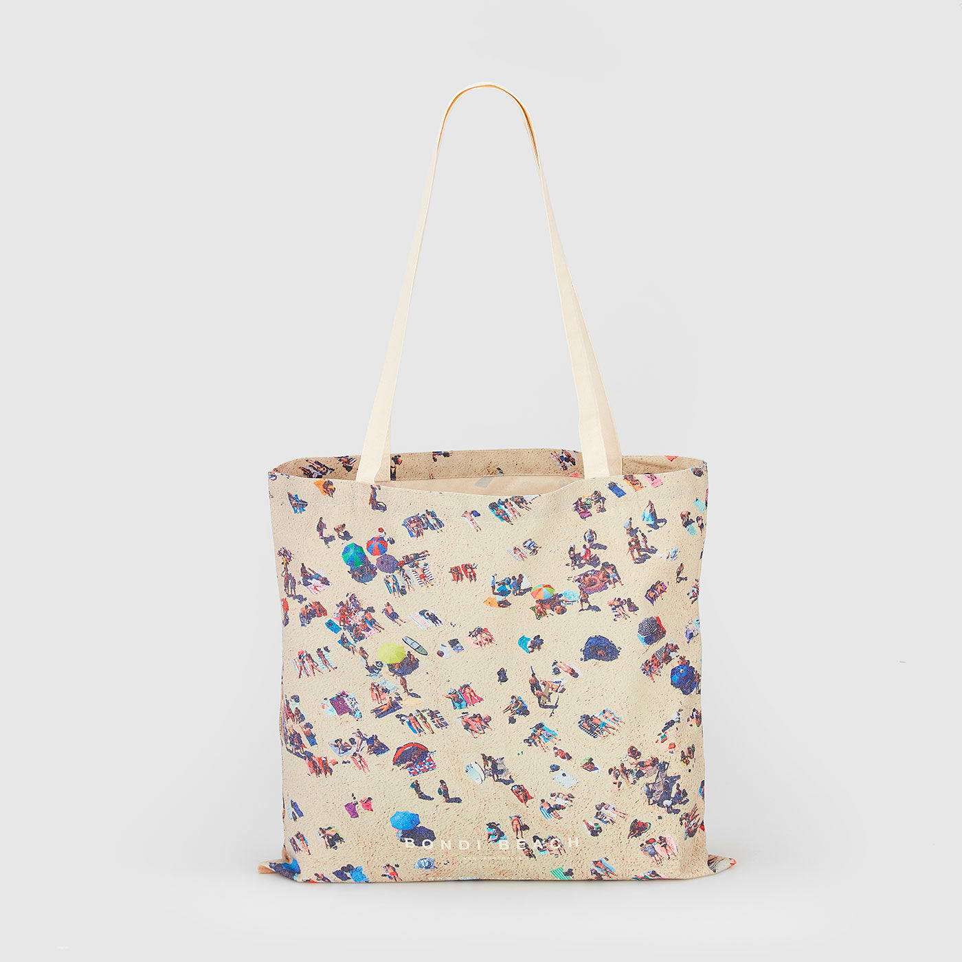 Aerial view of Bondi Beach crowd from above on cream canvas tote bag, canvas tote bag by Remy Gerega
