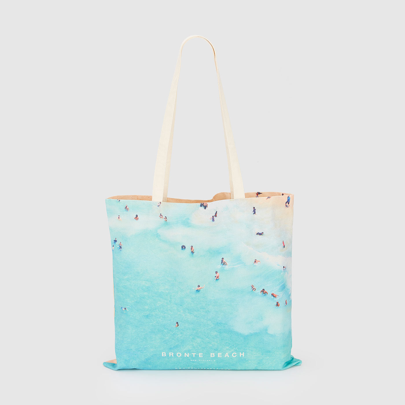 Aerial view of Bronte Beach with swimmers in turquoise water, canvas tote bag by Remy Gerega