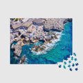 Aerial view of Capri's rocky coastline with turquoise waters and yellow beach umbrellas,500 piece jigsaw puzzle by Remy Gerega
