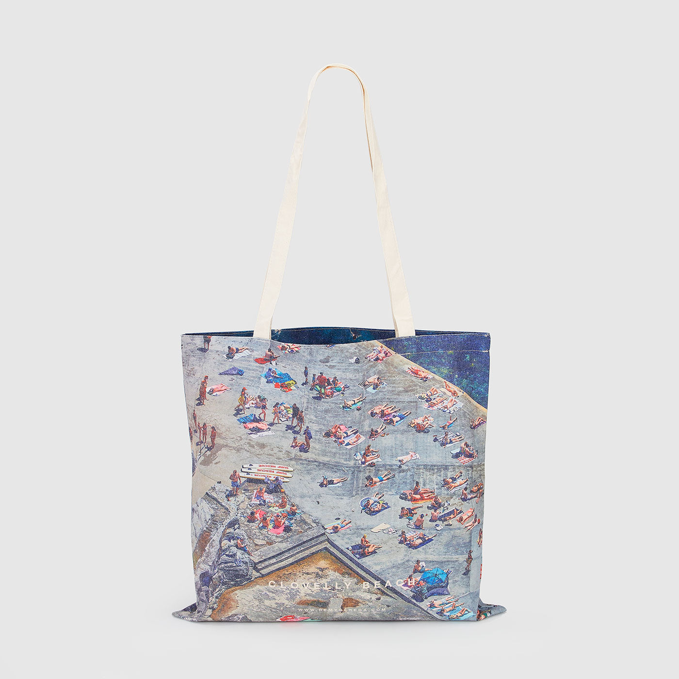 Aerial view of Clovelly Beach crowded with sunbathers and swimmers, canvas tote bag by Remy Gerega