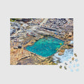 Aerial view of Mahon Pool's turquoise waters surrounded by rocky cliffs, 500 piece jigsaw puzzle by Remy Gerega