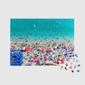 Aerial view of Monterosso al Mare beach with colorful umbrellas and swimmers, 500 piece jigsaw puzzle by Remy Gerega