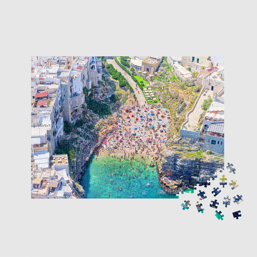 Aerial view of Polignano a Mare coastal cove with turquoise water and crowded beach,500 piece jigsaw puzzle by Remy Gerega