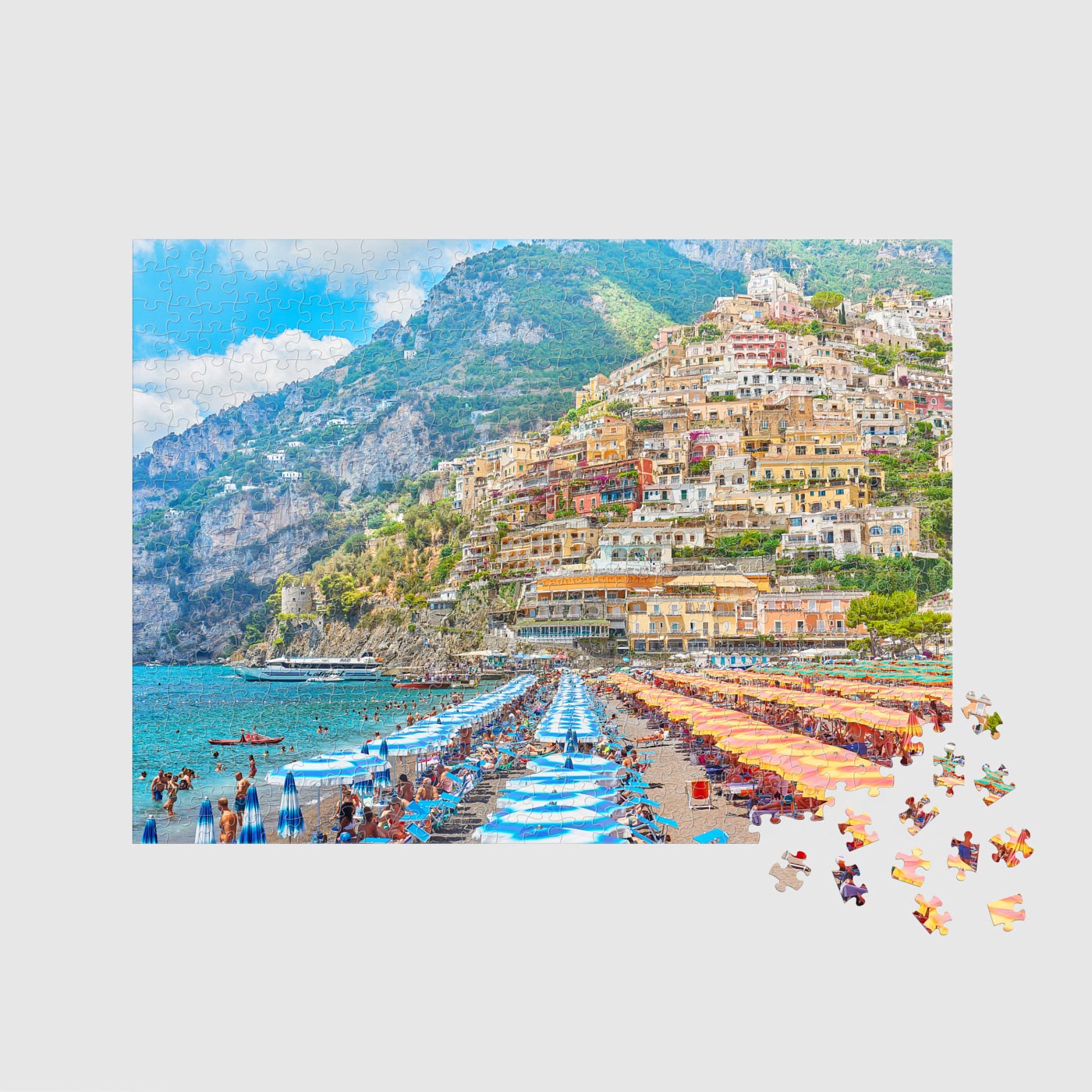 Positano coastal village with colorful cliffside buildings and blue beach umbrellas, 500 piece jigsaw puzzle by Remy Gerega