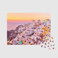 Santorini village at sunset with white-washed buildings and golden lights, 500 piece jigsaw puzzle by Remy Gerega
